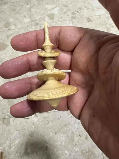 Wooden spinning top by Leon from Karmiel