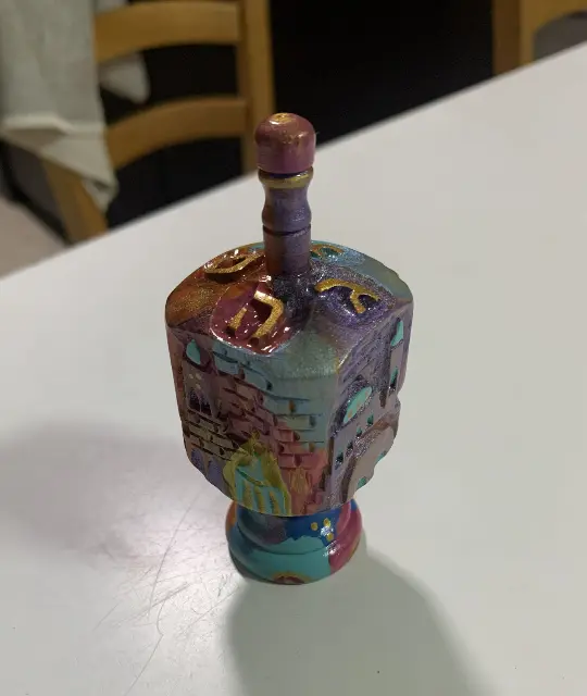 A spinning top from Avigdor Bezalel's product label