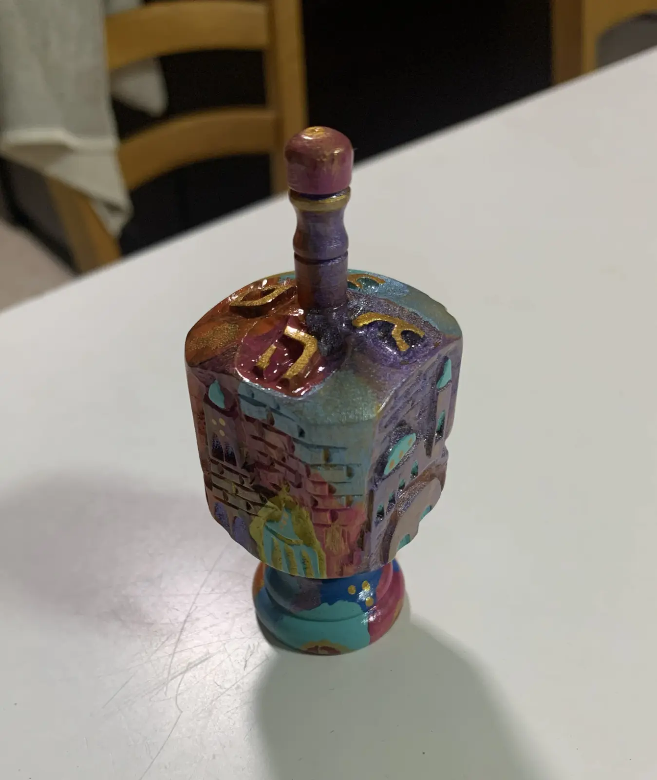 A spinning top from Avigdor Bezalel's product label