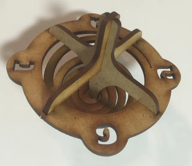 Self-assembled wooden spinning top by Barbara Shaw