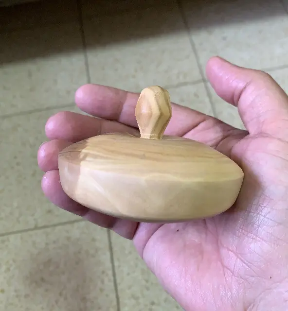 A carob wood engraving spinning top, a collector's birthday gift