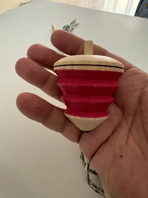 Hybrid spinning top by Mader and Alexander and Shay