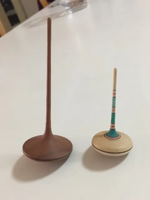Hand-held spinning tops from Madar