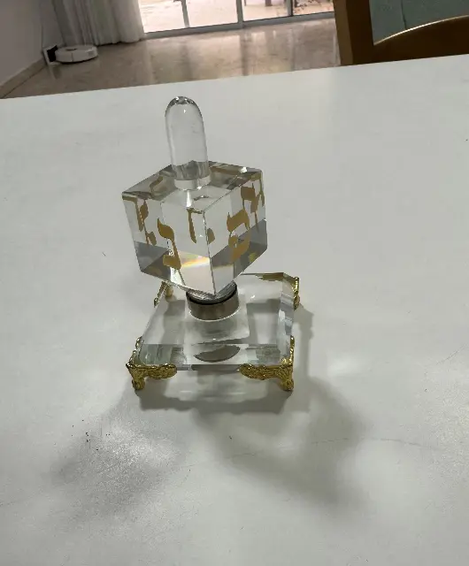 Gold-tone crystal spinning top from Hoshen Company, a gift from my brother Gil