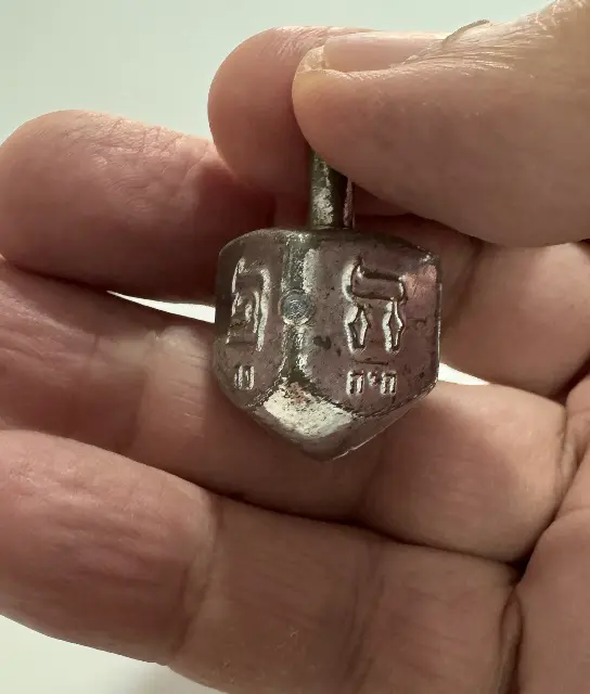 Silver plastic Dreidel from the 1950s-1960s
