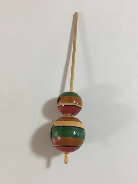 A hand-turned dried gourd spinning top from Indonesia