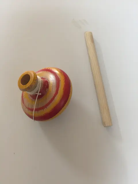 Spinning top with rod and string launcher from Budapest, Hungary