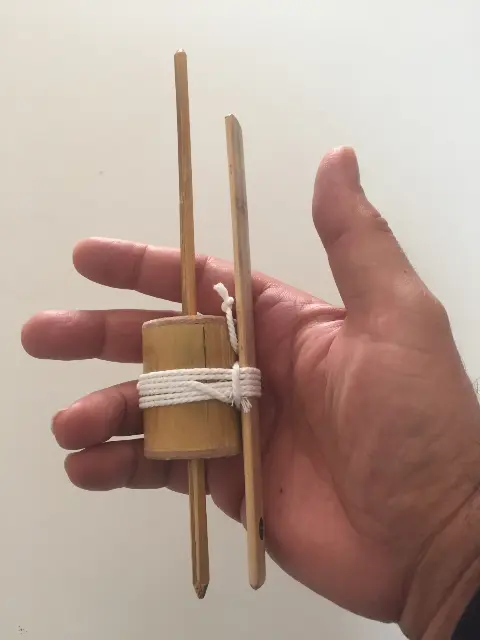 Bamboo Humming spinning top with launcher from Indonesia