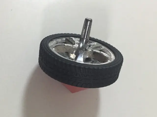 A spinning top made from a toy car wheel, Singapore