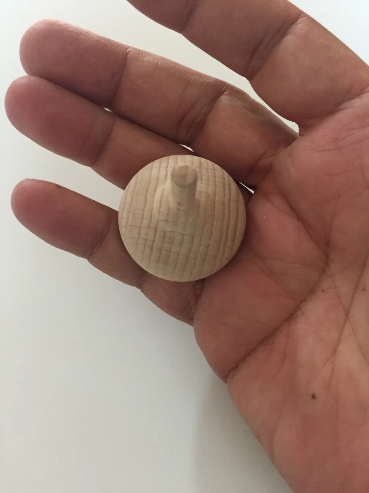 A natural wood engraved spinning top from Budapest, Hungary