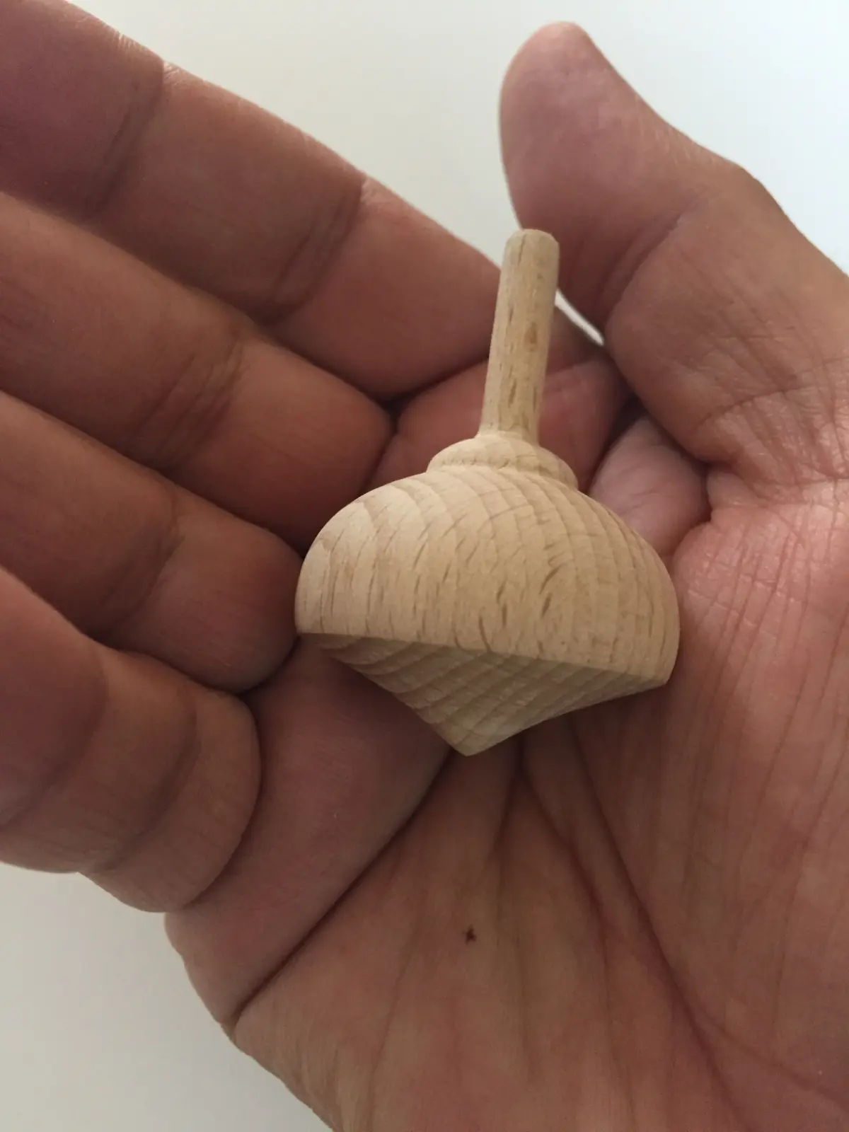 A natural wood engraved spinning top from Budapest, Hungary