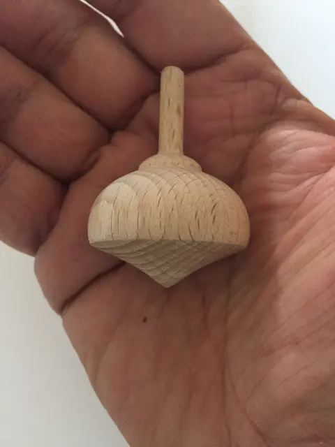 A natural wood engraved spinning top from Budapest, Hungary