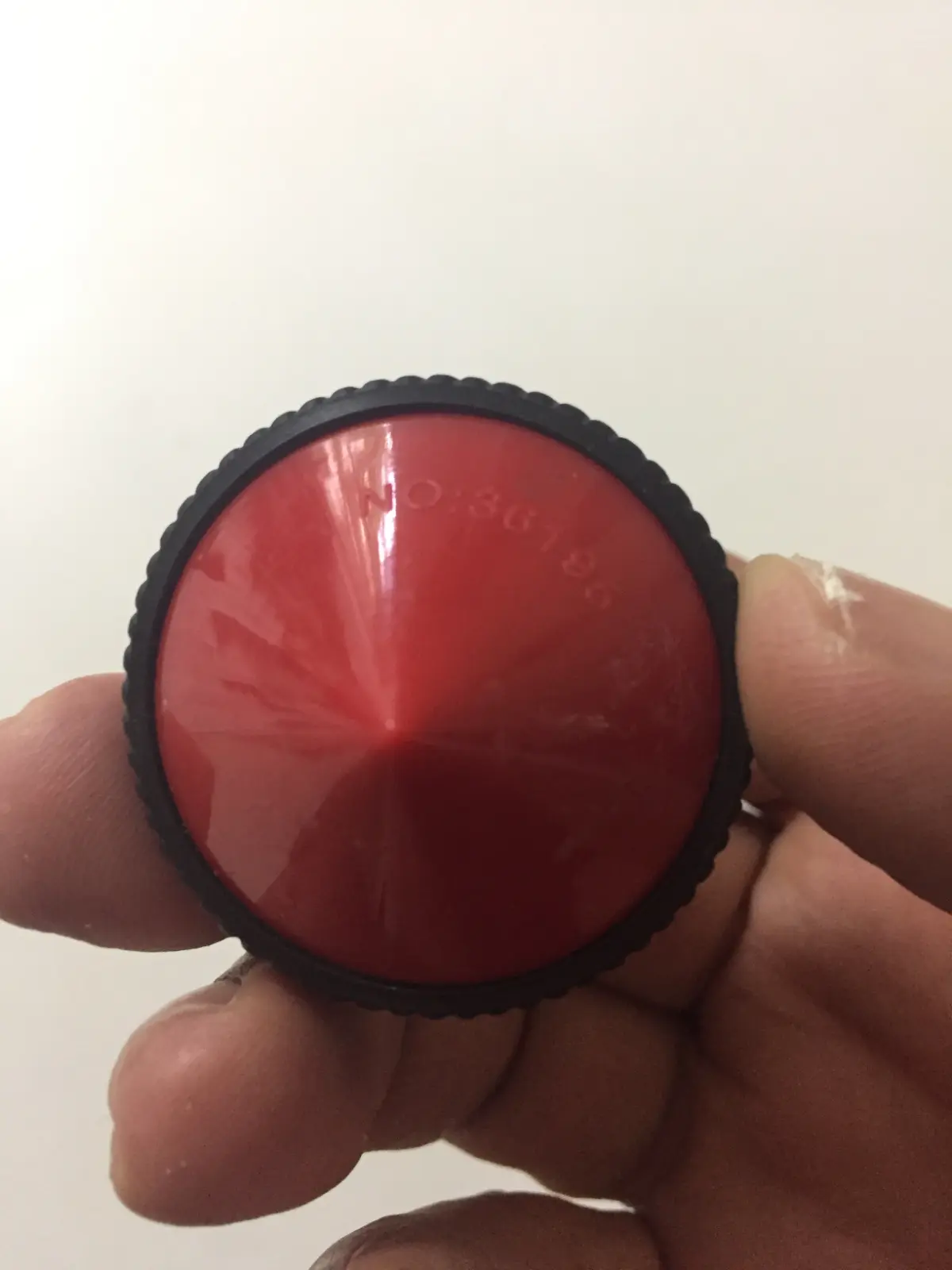 A spinning top made from a toy car wheel, Singapore