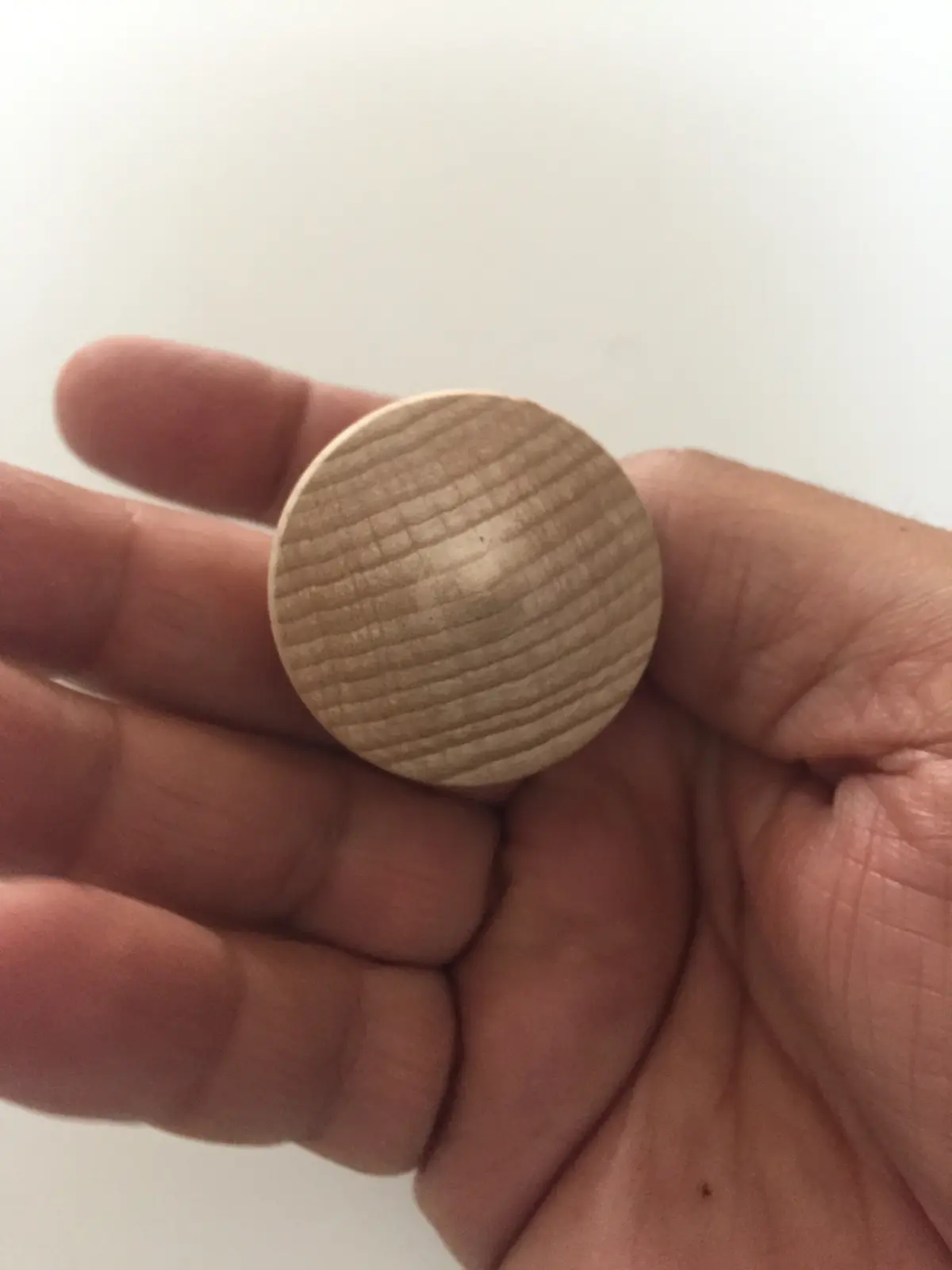 A natural wood engraved spinning top from Budapest, Hungary