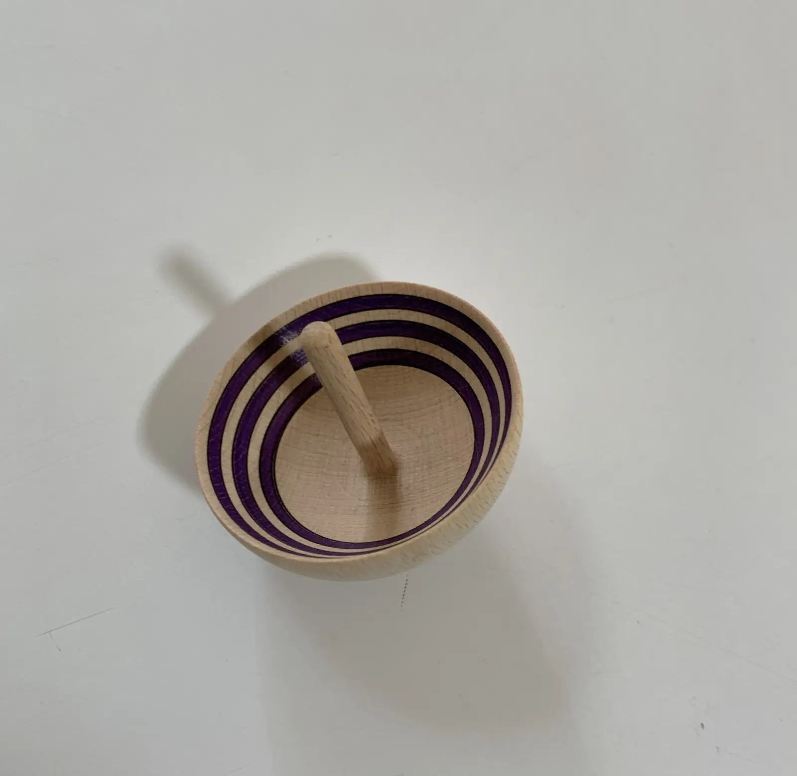 A cup-shaped spinning top made in Greece