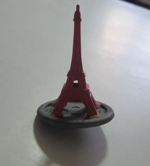 Plum wood spinning top by the Swiss company Naef