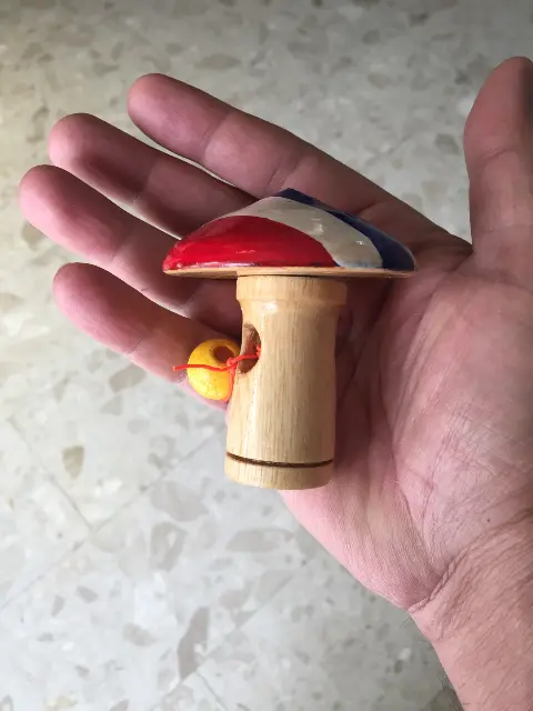Spinning top with launcher and Thai flag
