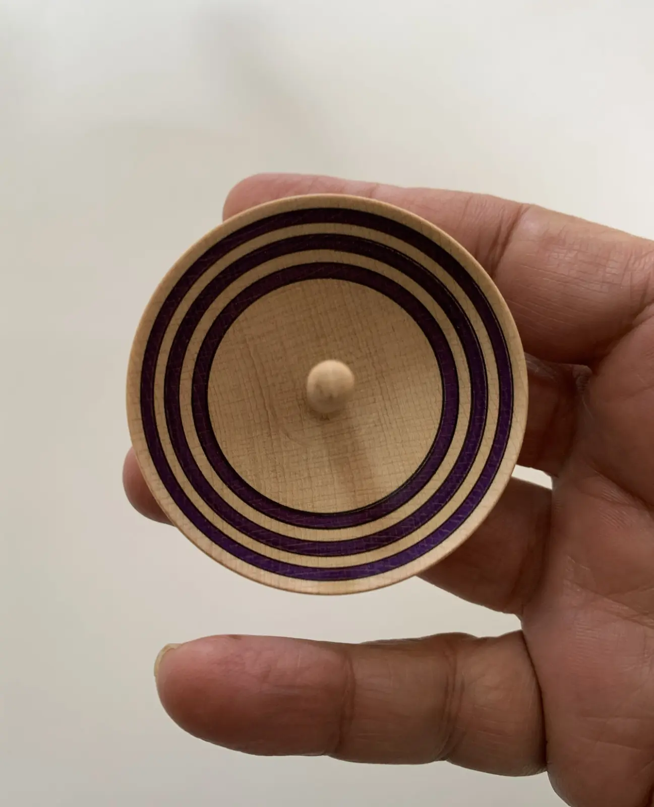 A cup-shaped spinning top made in Greece