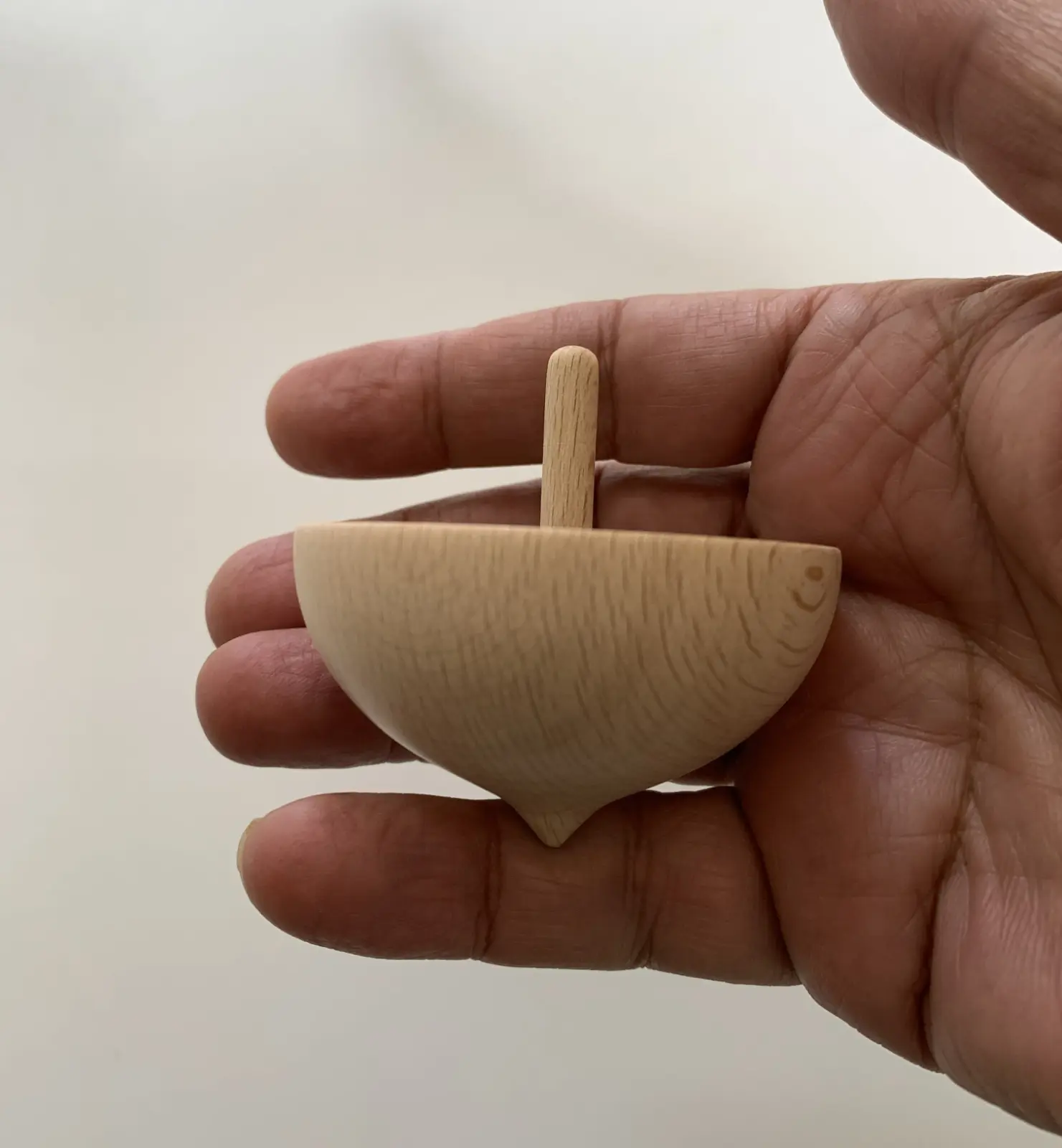 A cup-shaped spinning top made in Greece