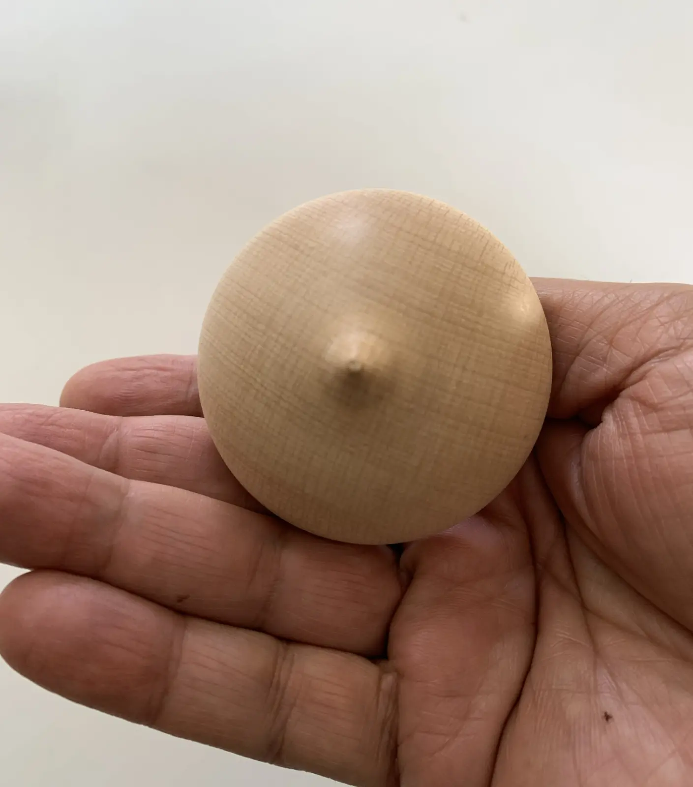 A cup-shaped spinning top made in Greece