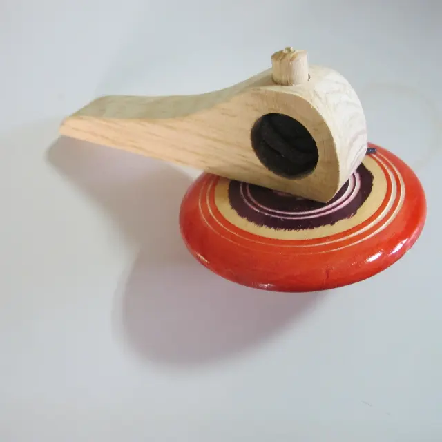 Purple spinning top with launcher from Prague, Czech Republic