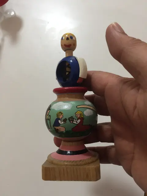 Painted spinning top with launcher ring and string from Prague, Czech Republic