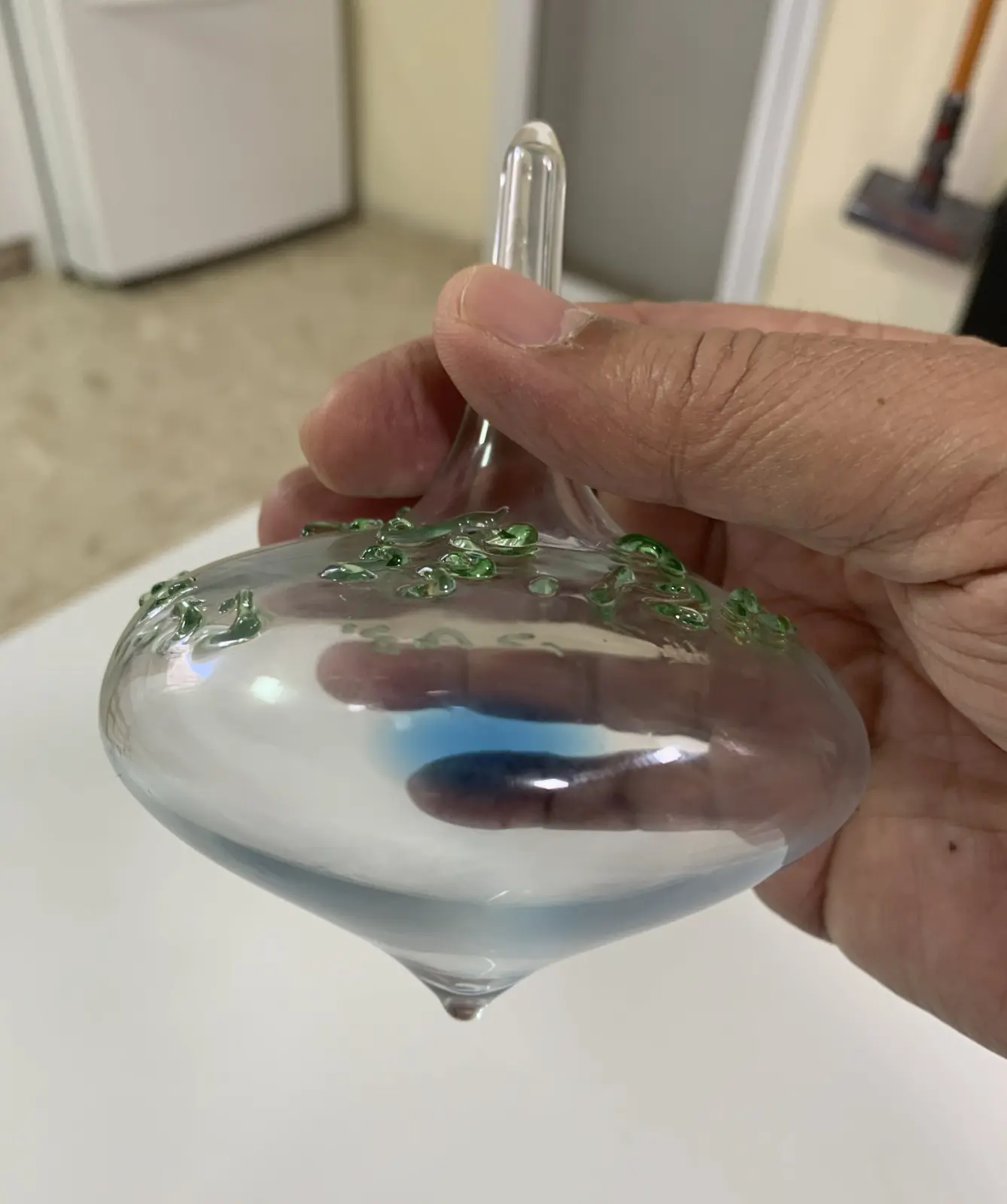 Glass spinning tops with blue liquid from the workshop of Yitzhak Cohen Arazi as part of the Chanukah activities of the Uri Foundation 2022