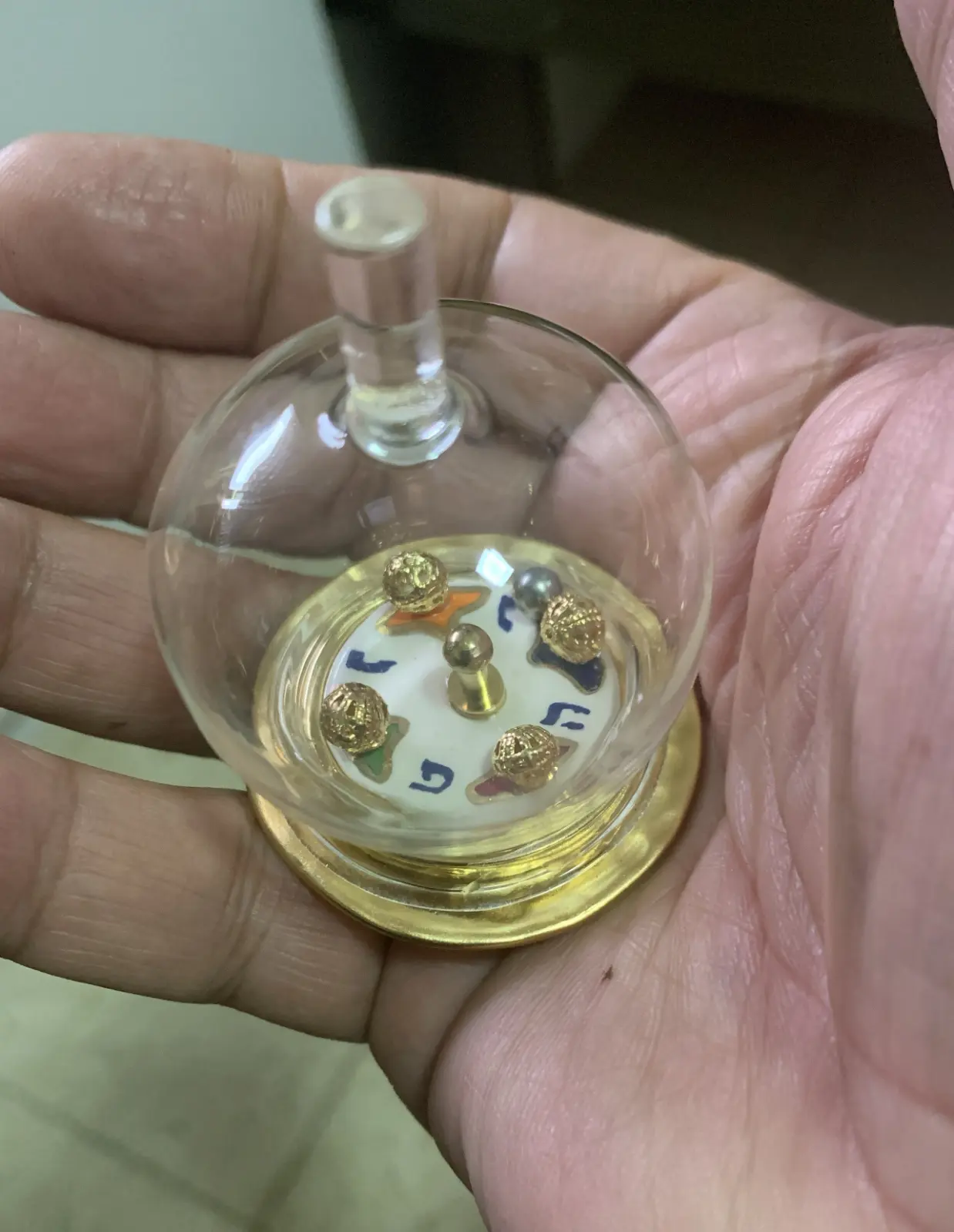 Hanukkah spinning top, ceramic glass and metal balls by Eran Graveler from the spinning top house
