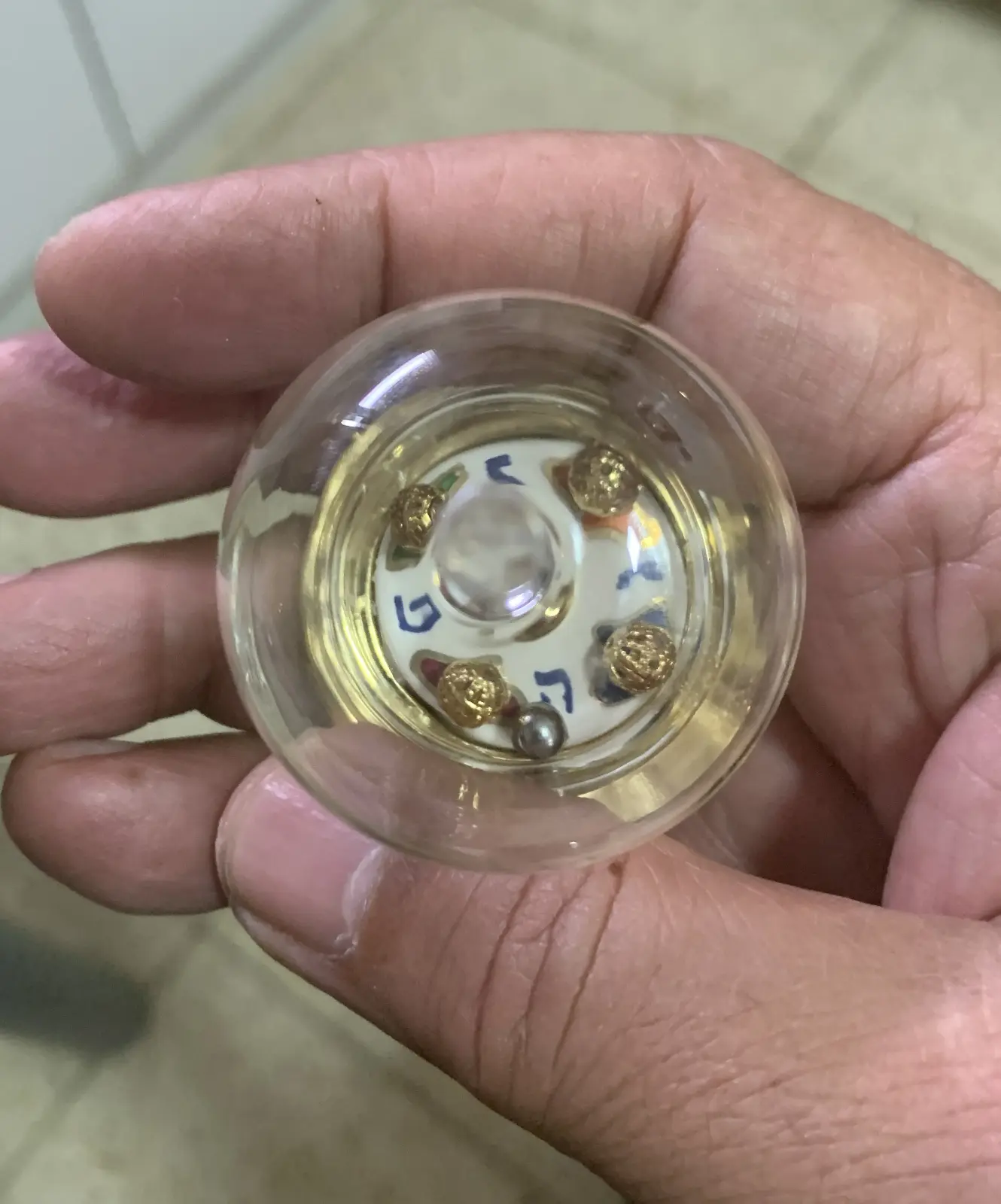 Hanukkah spinning top, ceramic glass and metal balls by Eran Graveler from the spinning top house