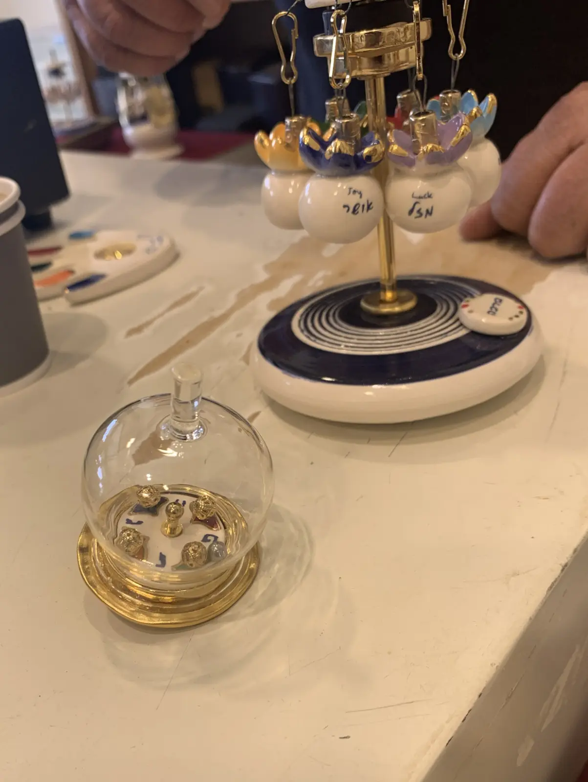 Hanukkah spinning top, ceramic glass and metal balls by Eran Graveler from the spinning top house