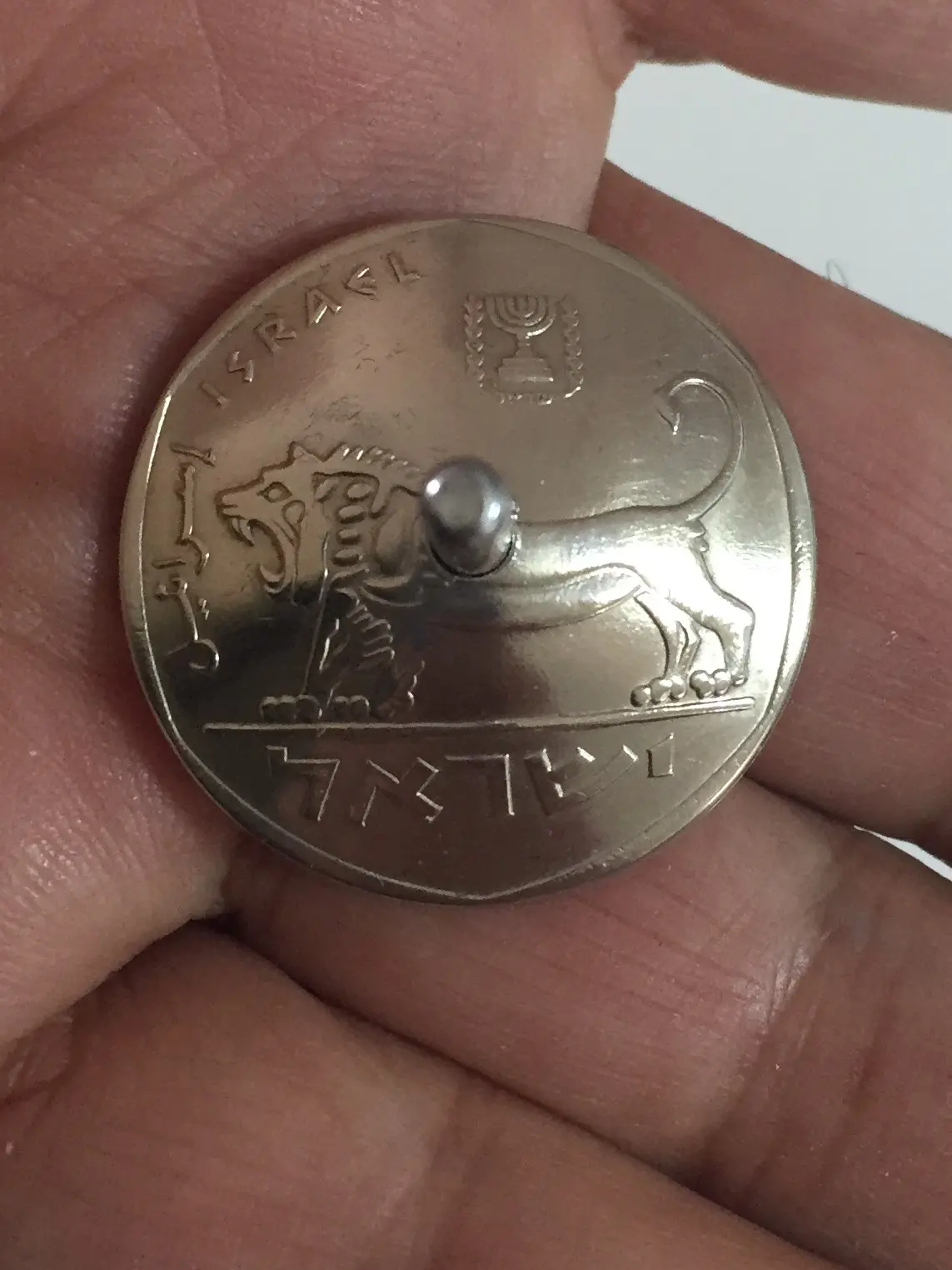 Spinning top 100 shekel coin Marin Shavit