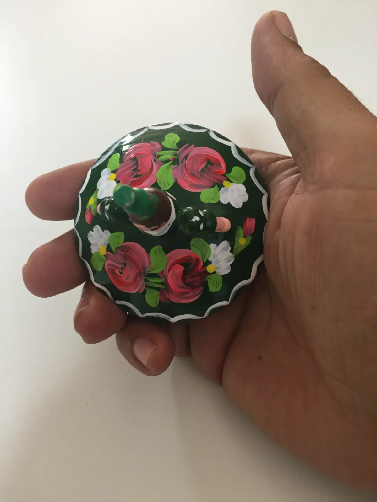 Spinning top dancer with a green dress from Hungary