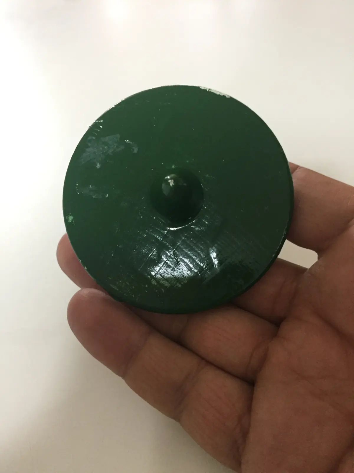 Spinning top dancer with a green dress from Hungary